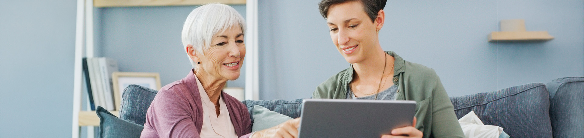 two women using an ipad